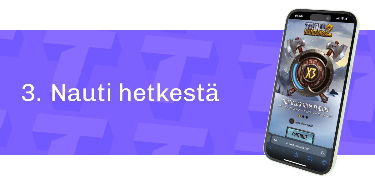 Kuvassa näkyy puhelimen näyttö, jossa hedelmäpeli Troll Hunters 2 on käynnissä. Taustalla on violetti kuvio, ja tekstinä lukee "3. Nauti hetkestä".